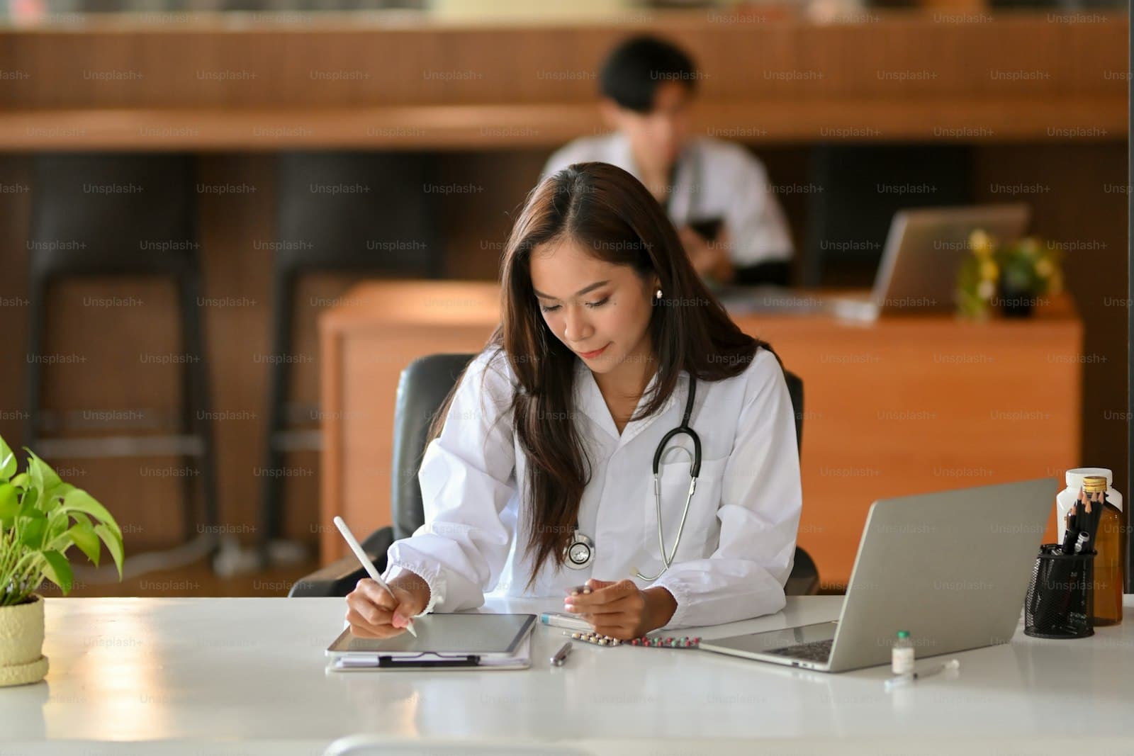 Provider documenting a patient encounter using a specialty-specific template on a tablet