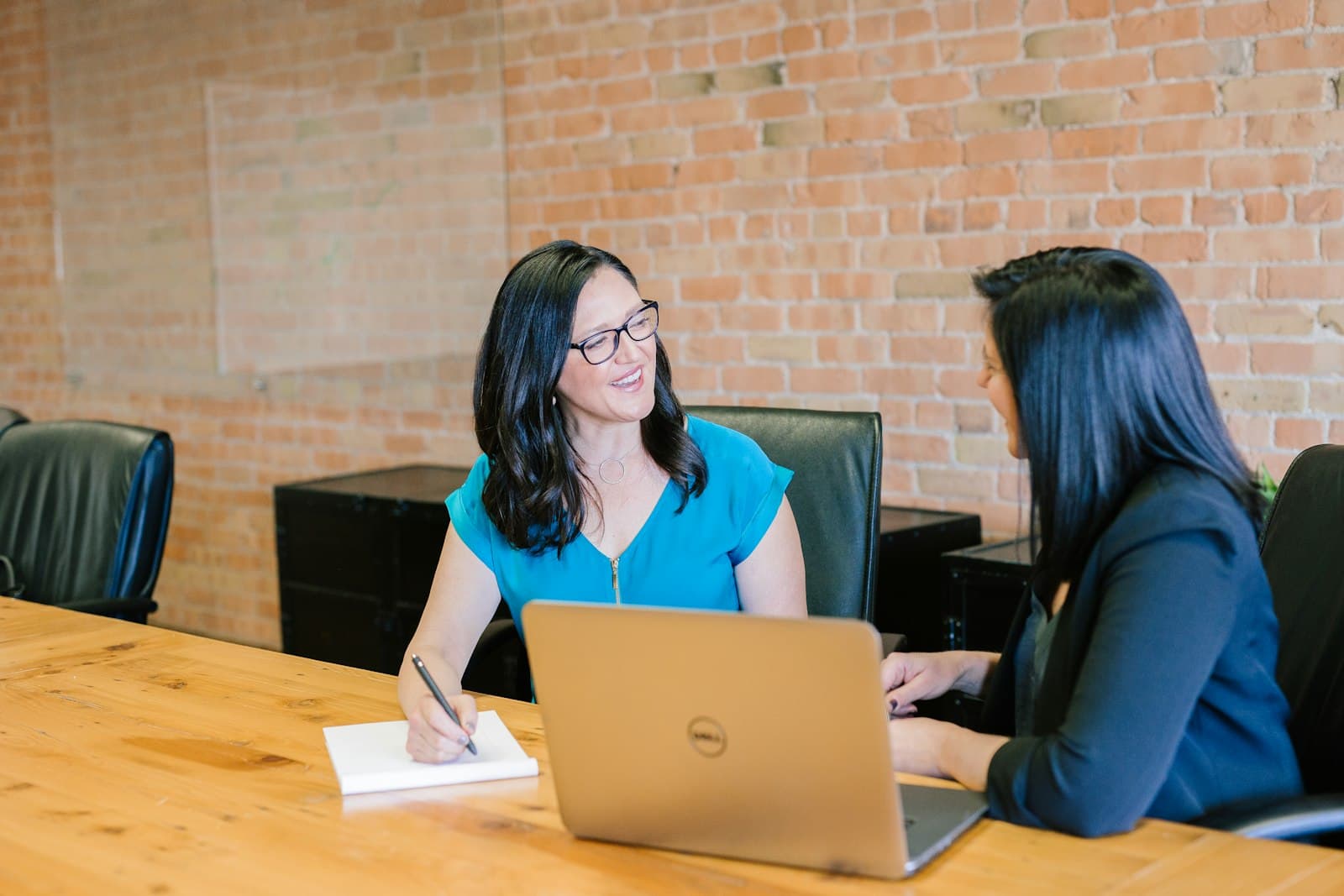 Clinical documentation reviewer working through trial document checklists on a laptop